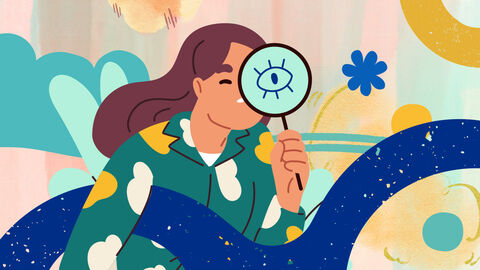 Jemand schaut durch eine Lupe.